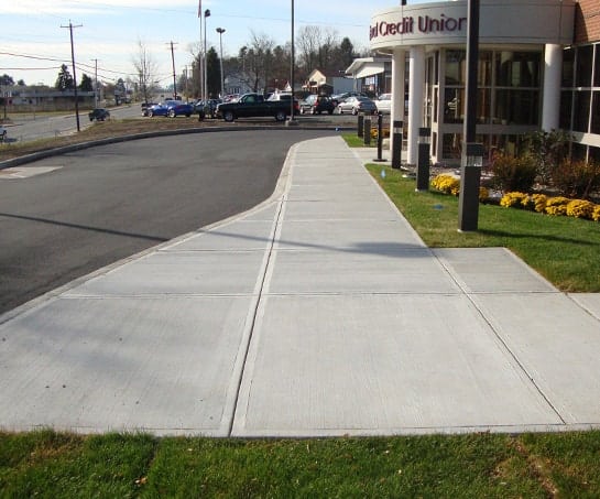 Exterior sidewalk and concrete curb